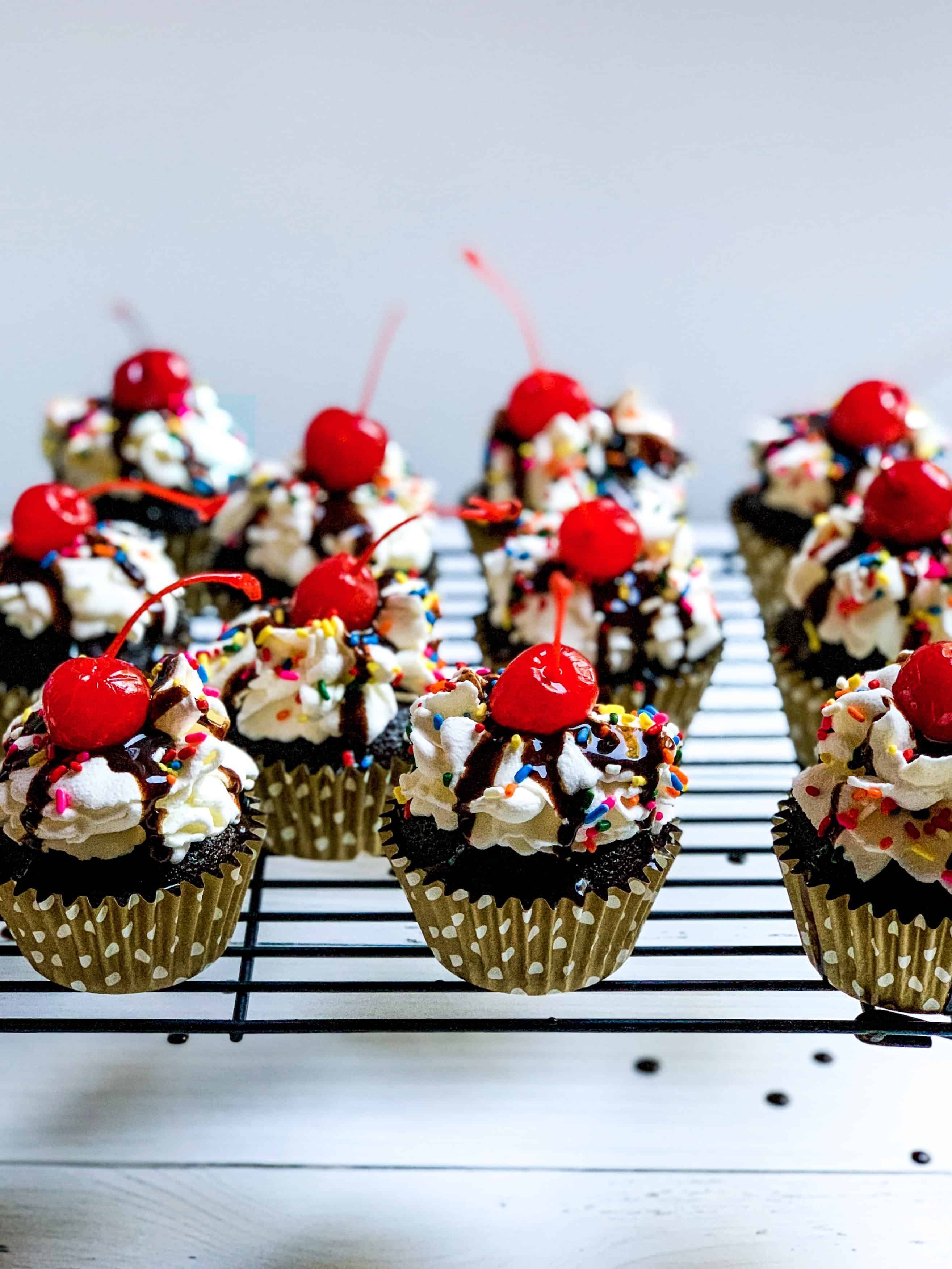 side view of cupcakes with gold polka dot liners