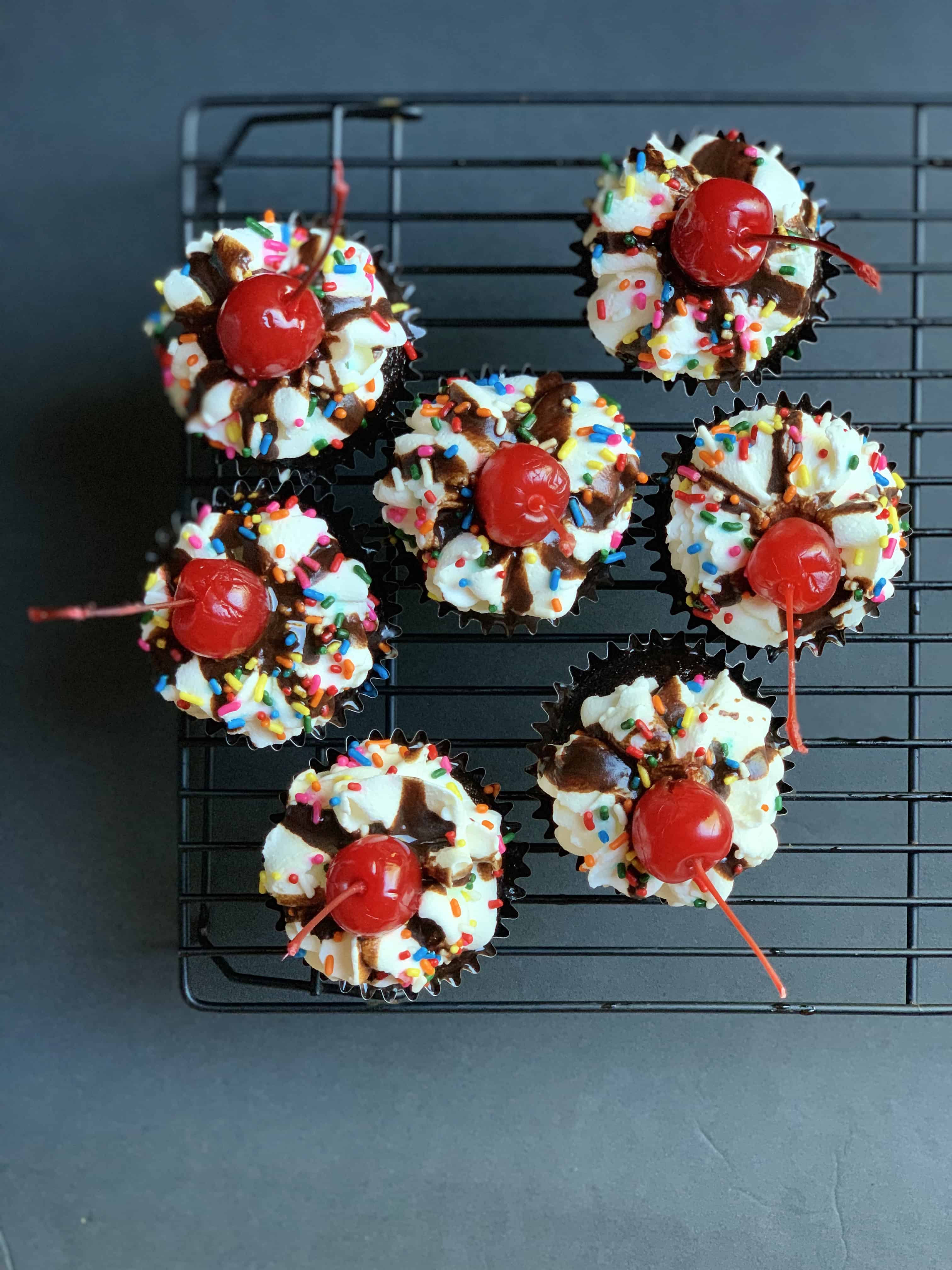 aerial view of 7 hot fudge sundae cupcakes