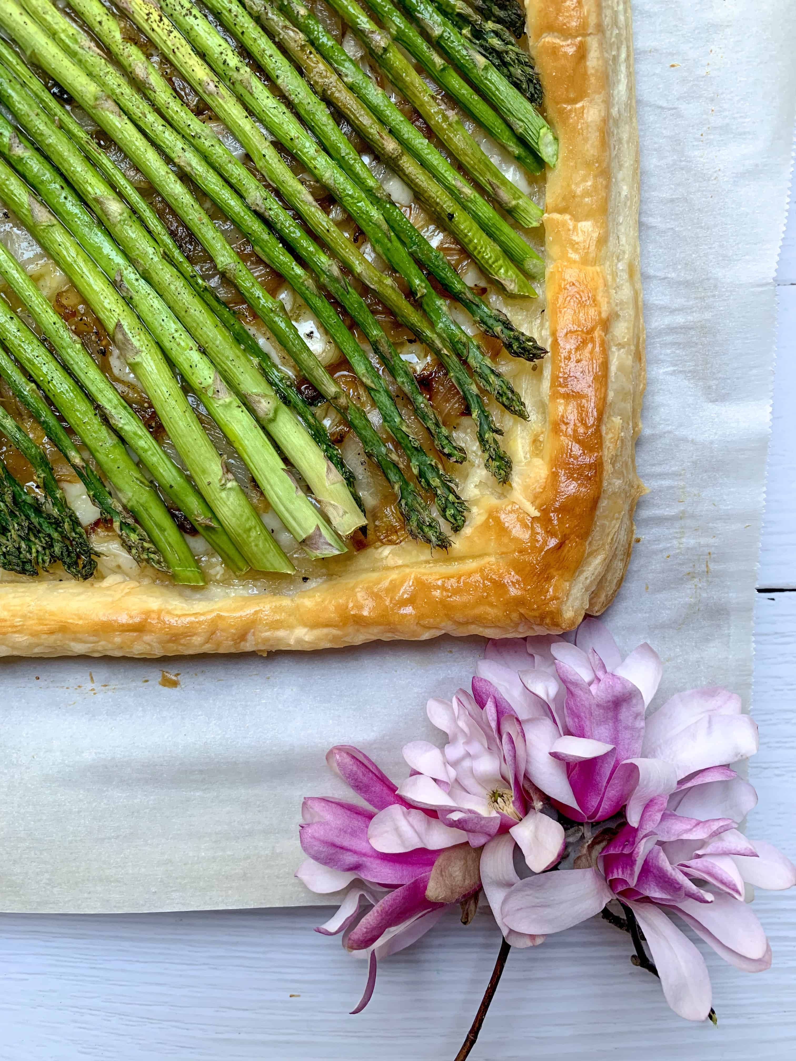 close up of asparagus and onion tart corner. 