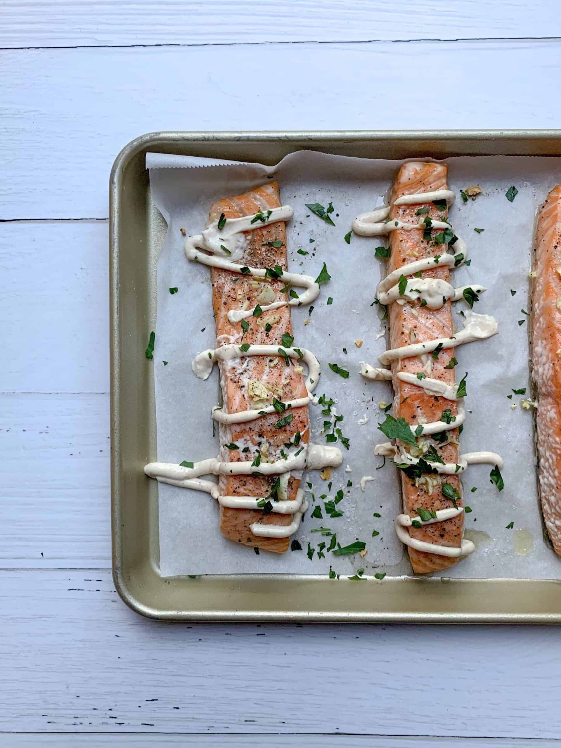 slow roasted salmon with lemon herb tahini dressing