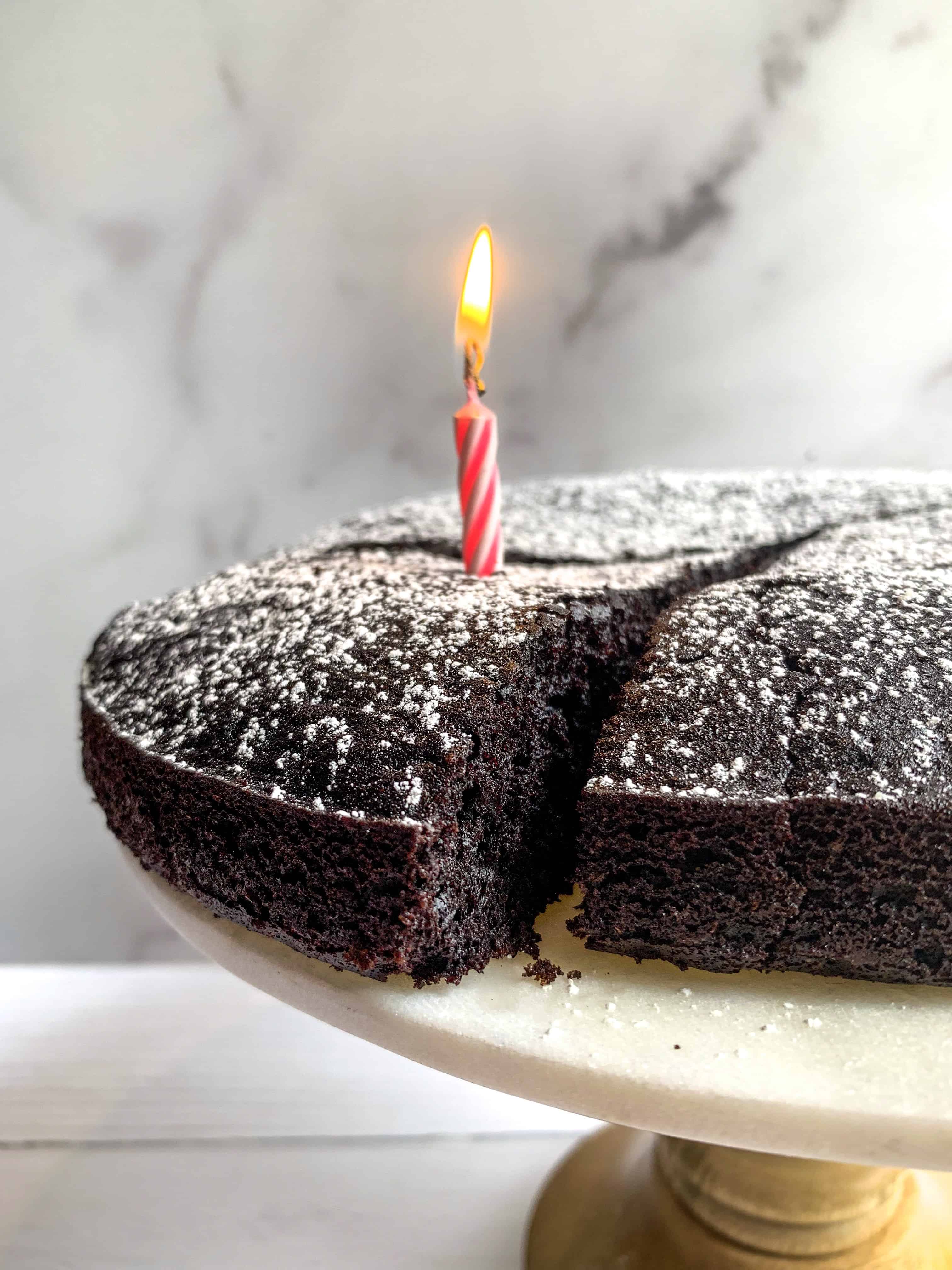 dairy free chocolate cake on stand