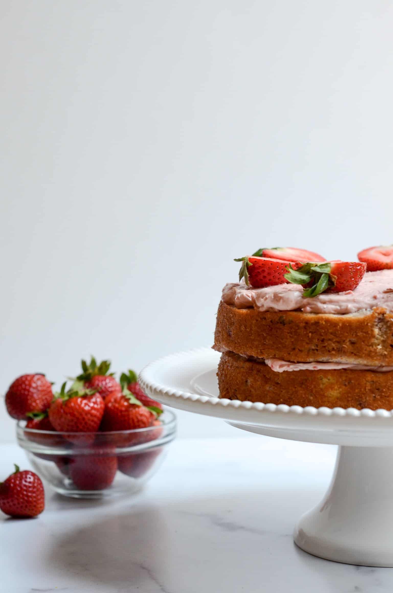strawberries next to naked strawberry cake