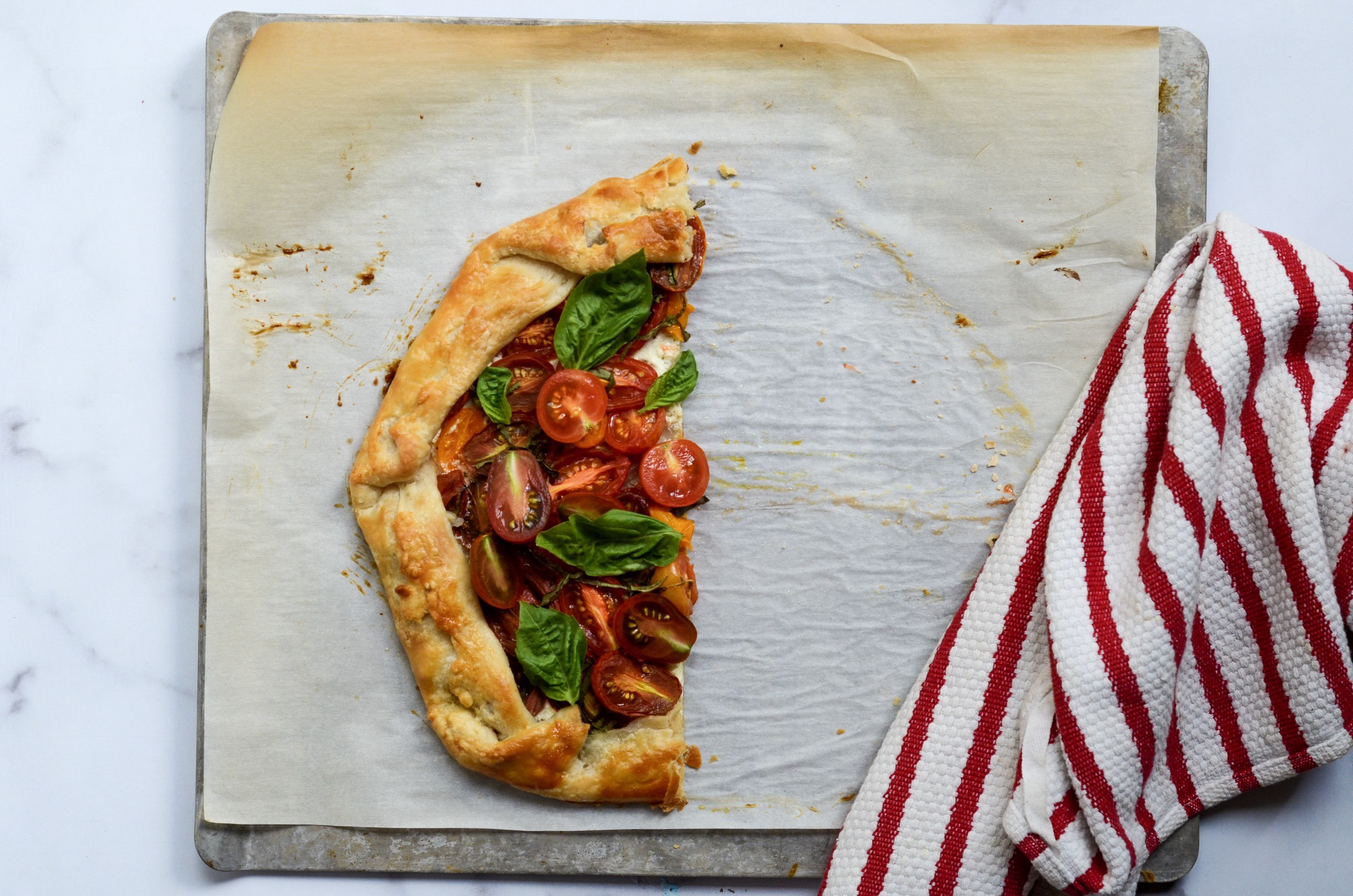 half of a goat cheese and tomato tart
