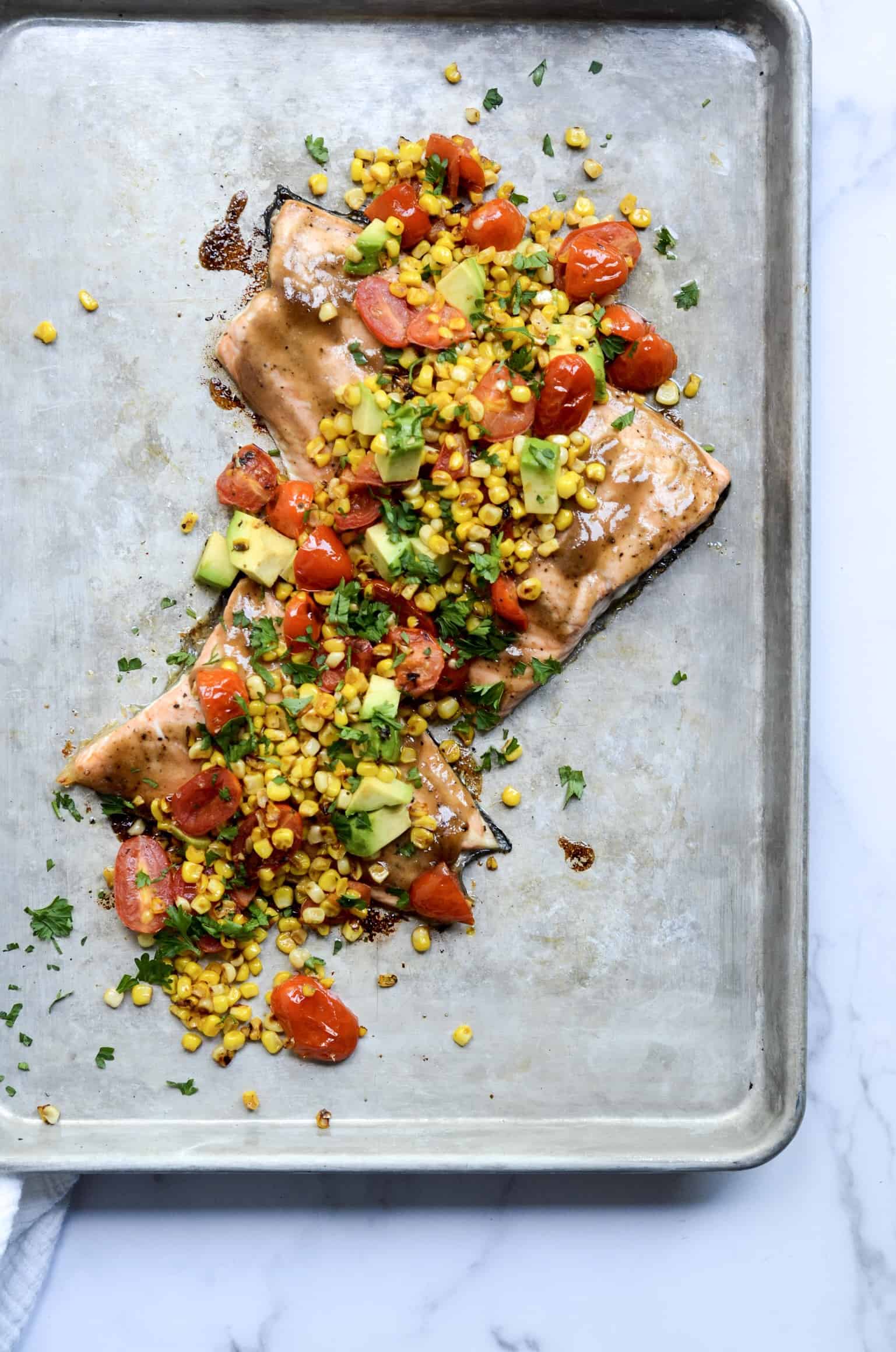 sheet pan salmon with corn, tomato, and avocado salsa