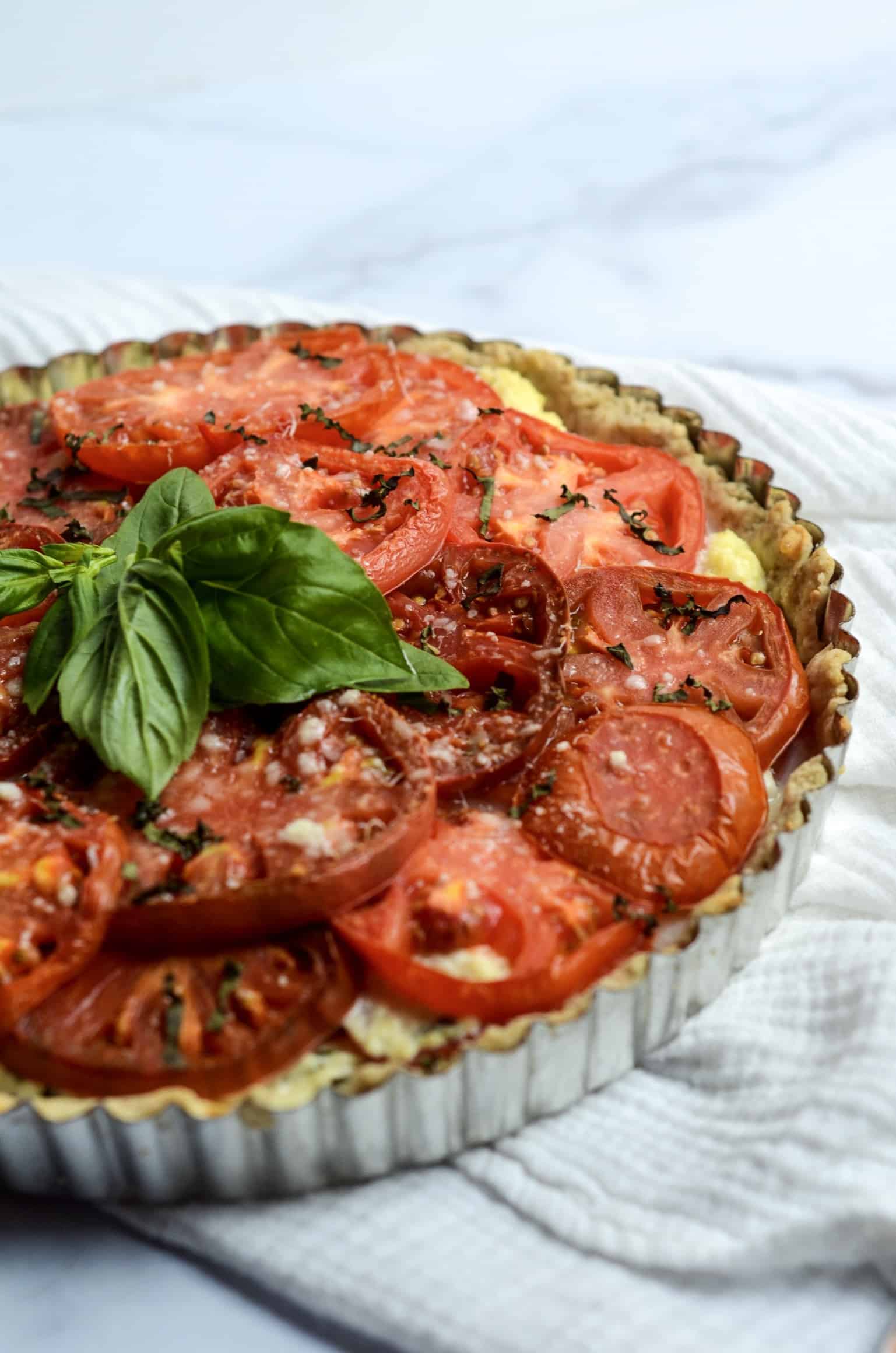 parmesan and basil on tomato pie