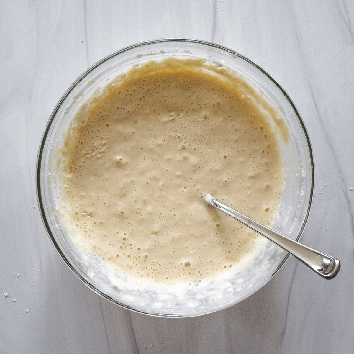 Step 1 of the directions showing the batter all mixed together in a glass bowl.