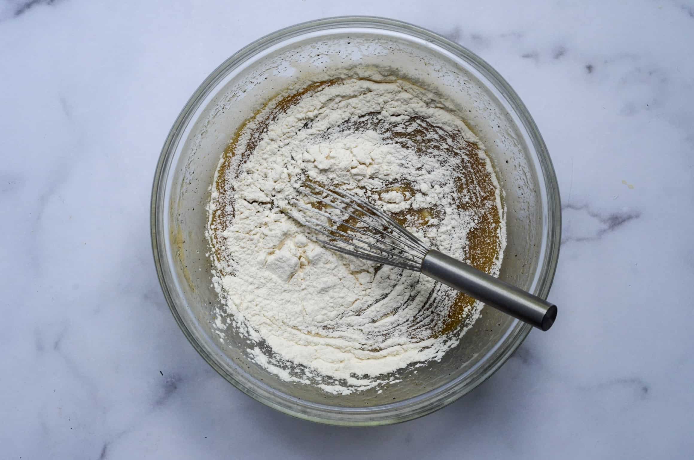 adding flour to the batter