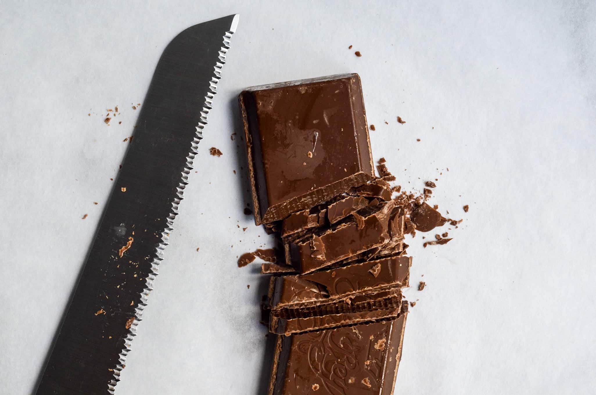 cut chocolate bar with serrated knife for pools of chocolate on your cookies
