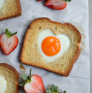 egg in a hole toast that's heart shaped