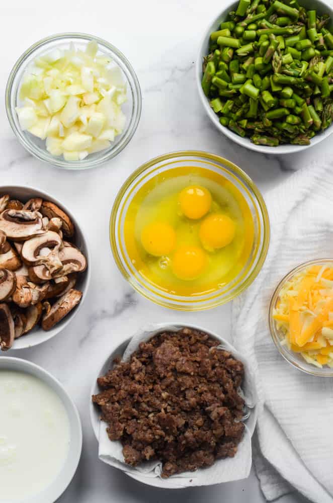 7 bowls of the ingredients needed to make mushroom quiche 