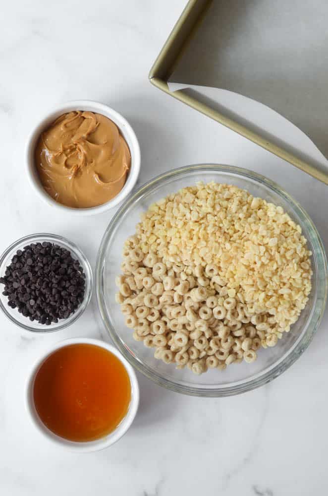 aerial shot of 5 ingredients in bowls you need to make homemade cereal bars