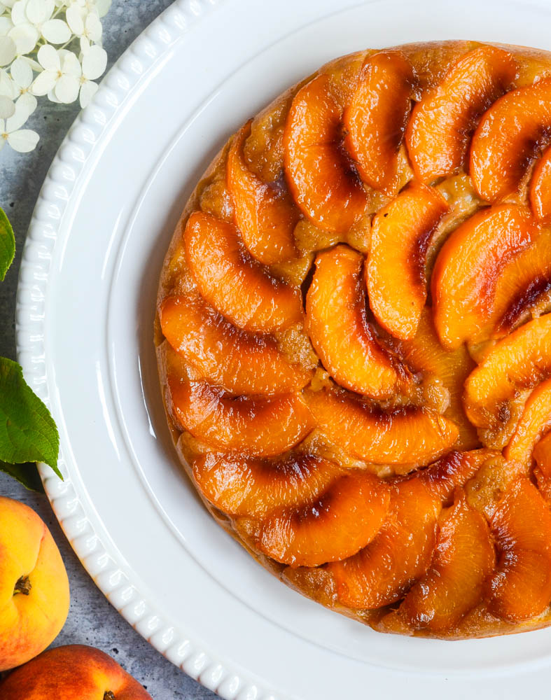 aerial view of peach cake on white platter