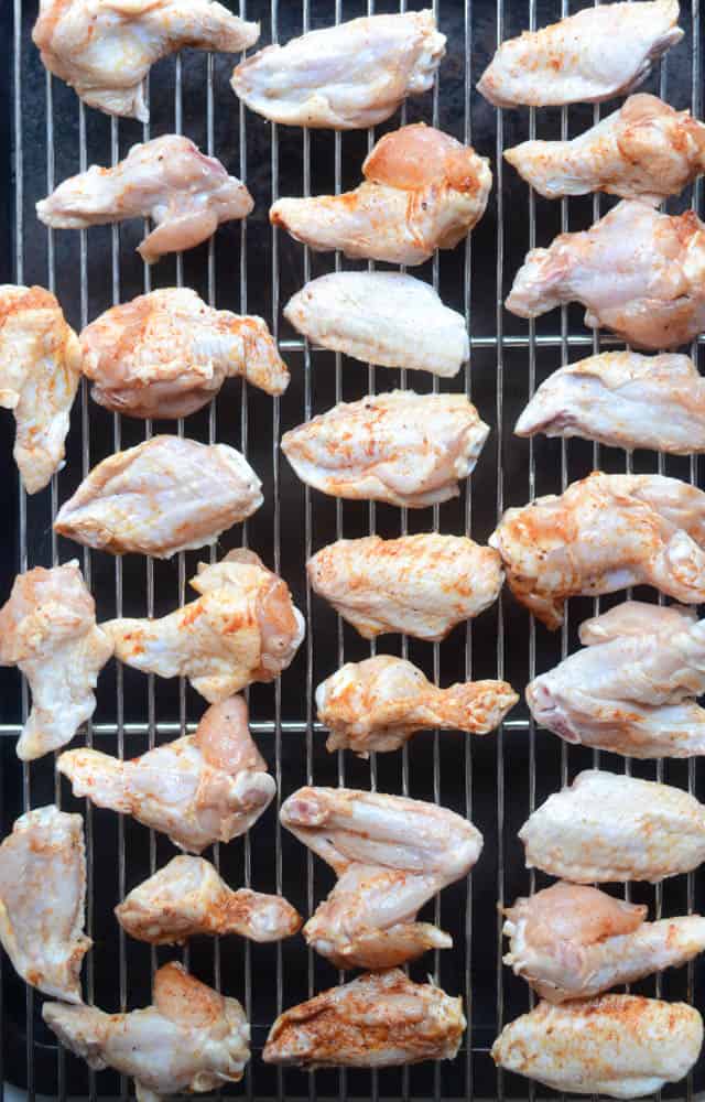 aerial view of chicken wings before cooking them on wire rack