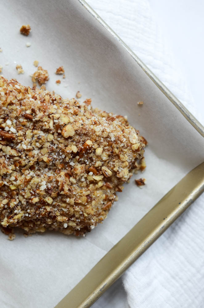 fillet encrusted with pecans on parchment lined baking sheet 