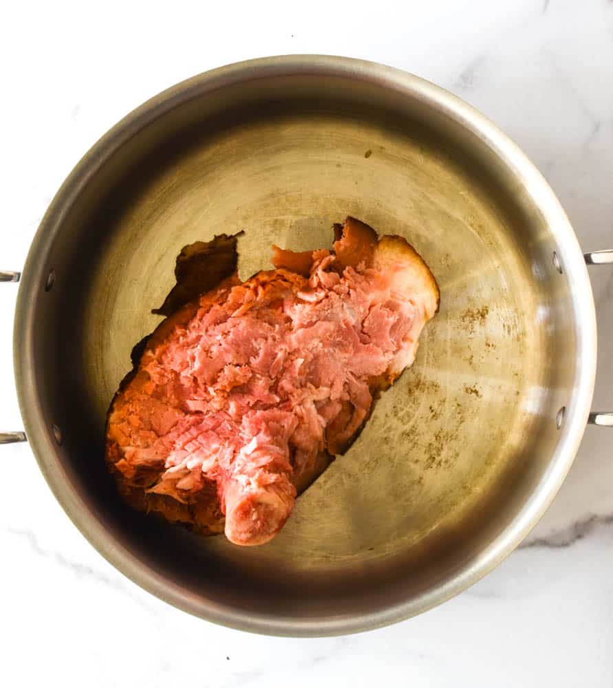 aerial picture of large stock pot with ham bone and water ready to be made into stock. 