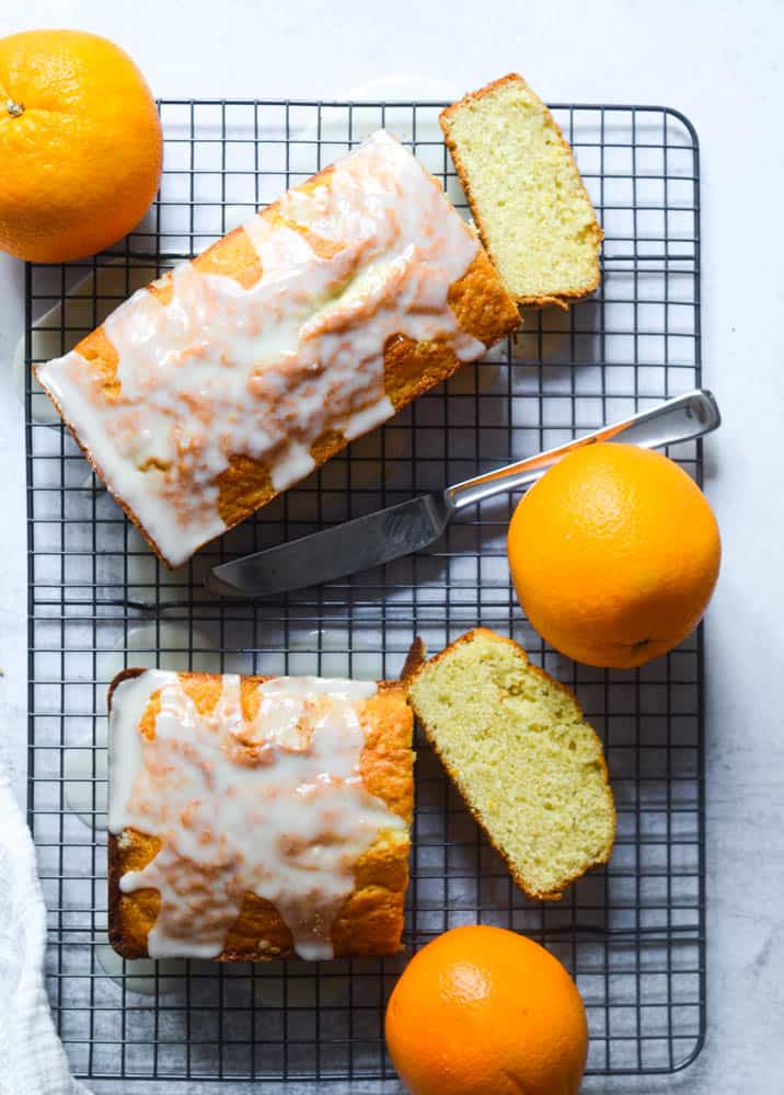 aerial picture of two loaves of pound cake with glaze drizzled on top. 