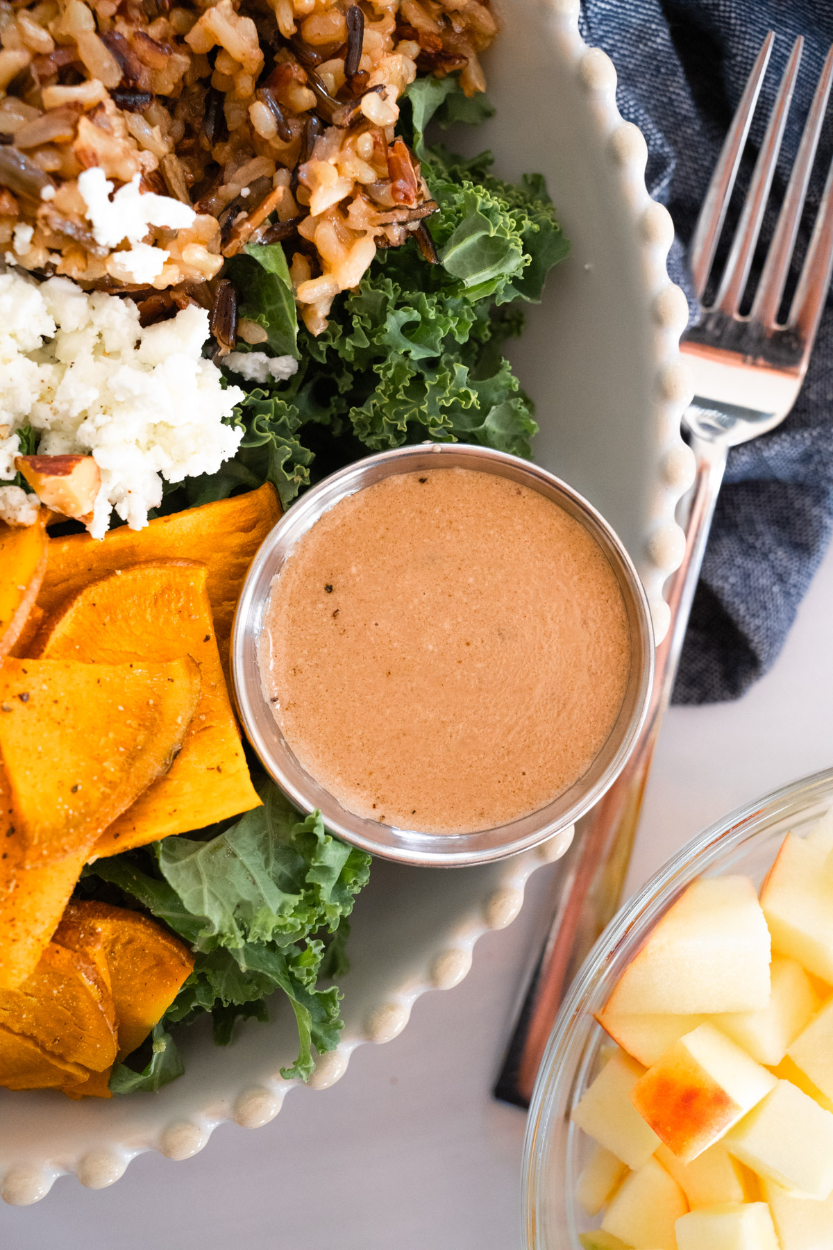 Close up picture of a small dish filled with creamy balsamic dressing.