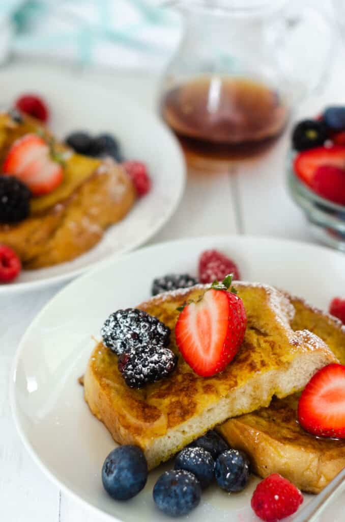 close up picture of sourdough french toast with fresh berries.