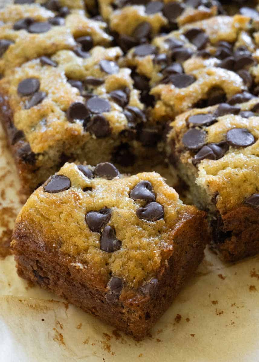 Close up picture of one piece of banana chocolate cake with chocolate chips on top. 