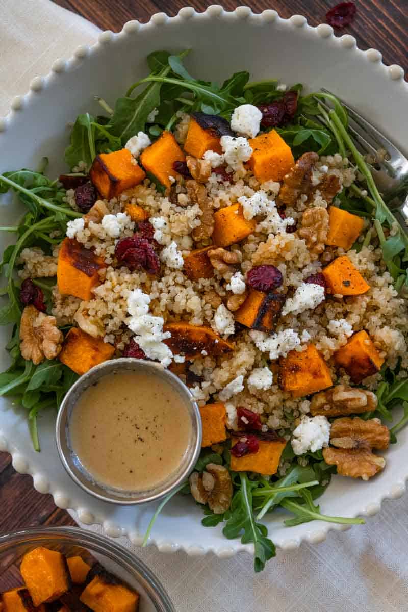 Close up picture of an arugula salad with roasted pumpkin. 