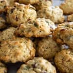 Close up of a bunch of bird seed cookies stacked upon one another.