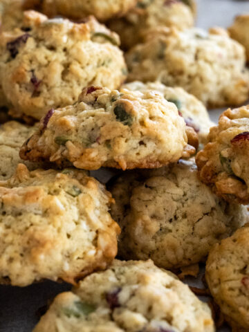 Close up of a bunch of bird seed cookies stacked upon one another.