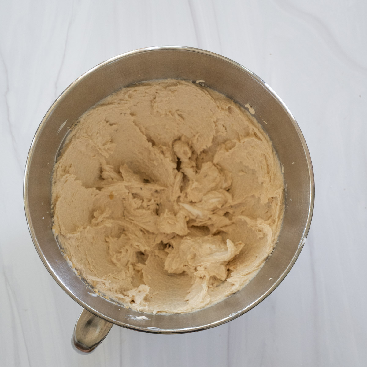 step 2 showing Crisco, granulated sugar, and brown sugar creamed together in a stand mixer bowl. 